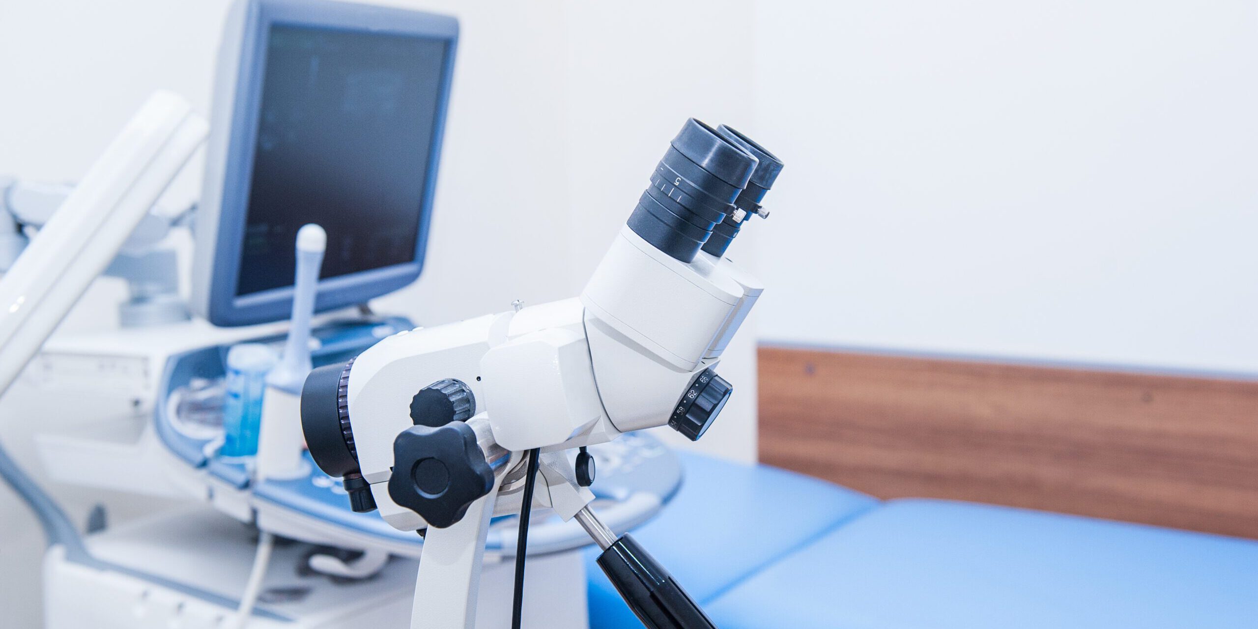 Close up colposcope on the background of ultrasound machine in gynecological room